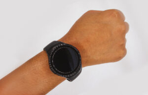 A person wearing an SOS Smartwatch on their wrist